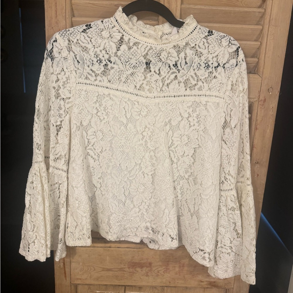 Elegant lace top with bell sleeve